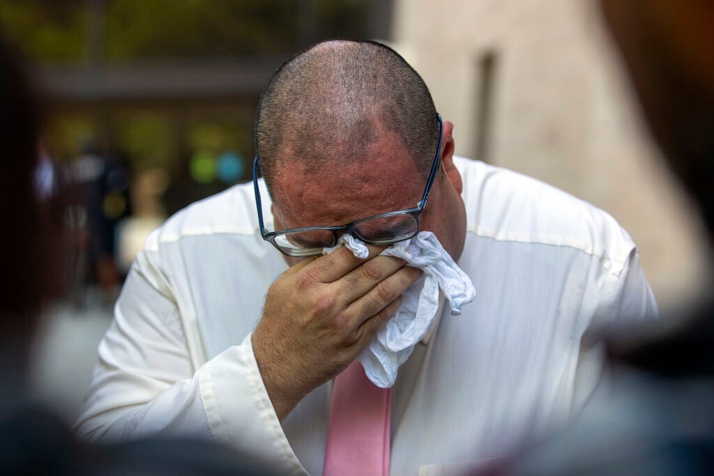 <p>Paul Jamrowski, father of Jordan Anchondo and father in-law of Andre Anchondo, who both died in the El Paso Walmart mass shooting, breaks down in tears while speaking to the media outside the federal court in El Paso, Texas, Wednesday, July 5, 2023. </p>