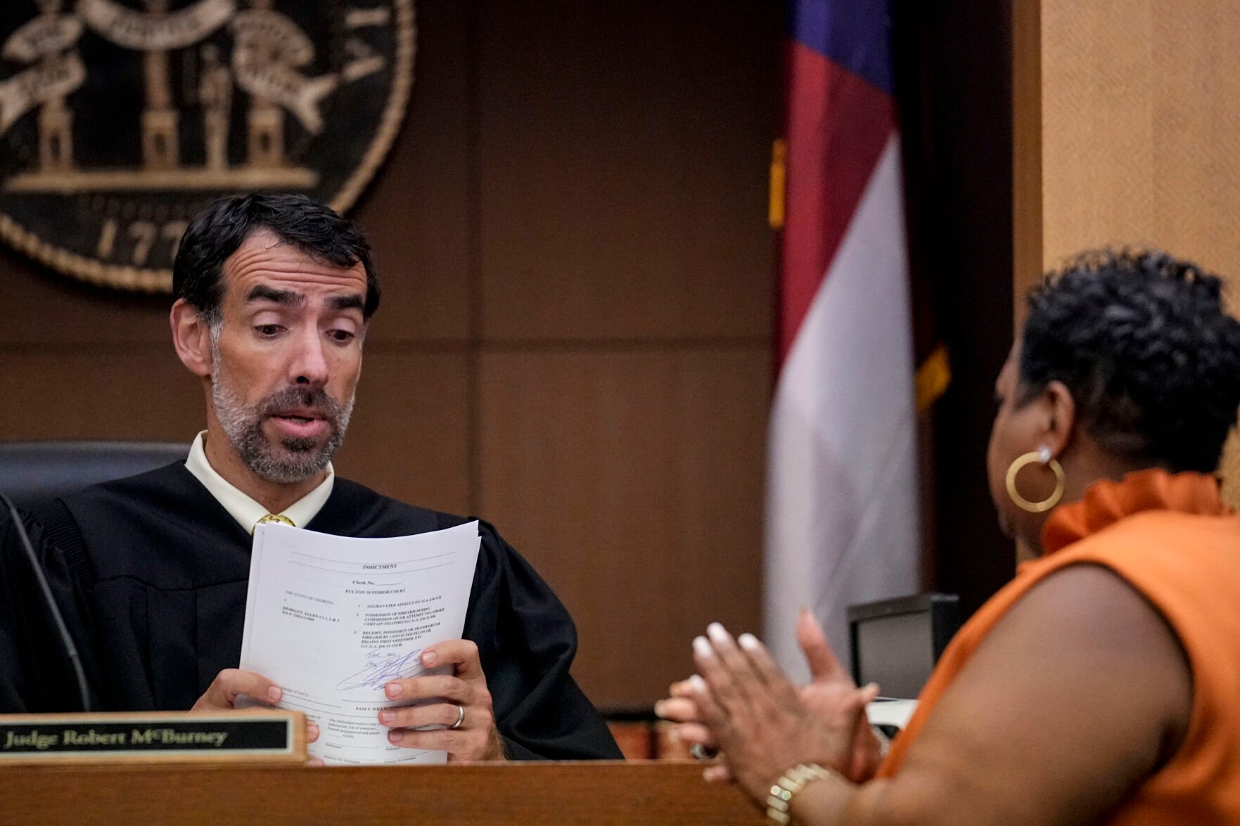 <p>County Clerk Che Alexander, right, speaks Monday with Fulton County Superior Court Judge Robert McBurney in Atlanta. </p>