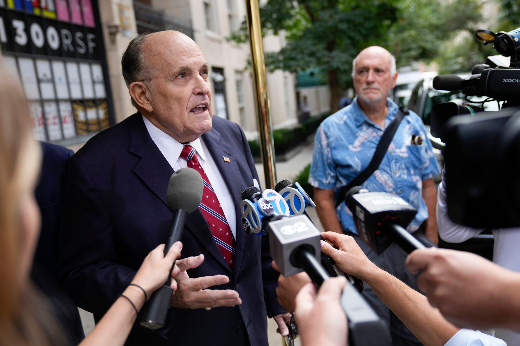 <p>Former Mayor of New York Rudy Giuliani speaks to reporters as he leaves his apartment building in New York, Wednesday, Aug. 23, 2023. (AP Photo/Seth Wenig)</p>