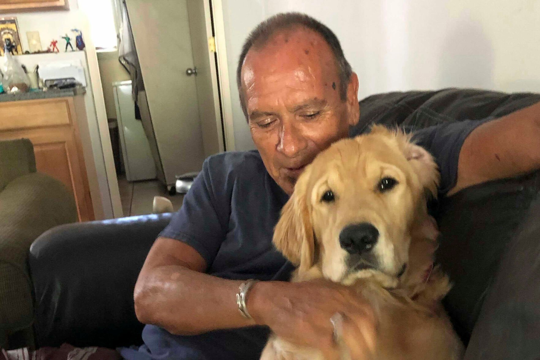 <p>Franklin Trejos with his golden retriever Sam.</p>