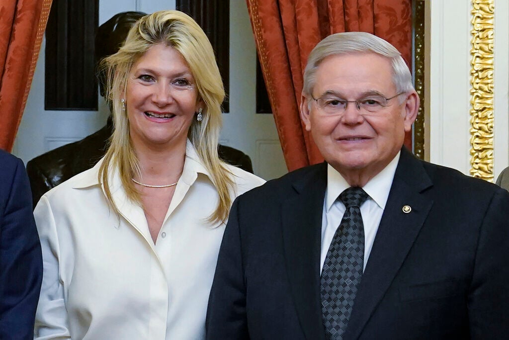 <p>FILE - Senate Foreign Relations Committee Chairman, Sen. Bob Menendez, D-N.J., right, and his wife Nadine Arslanian, pose for a photo on Capitol Hill in Washington, Dec. 20, 2022. </p>