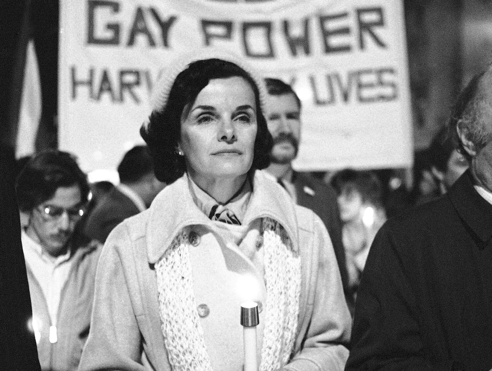 <p>FILE - San Francisco Mayor Dianne Feinstein carries a candle as she leads an estimated 15,000 marchers also carrying candles during a march in memory of slain Mayor George Moscone and Supervisor Harvey Milk in San Francisco, Nov. 28, 1979. </p>