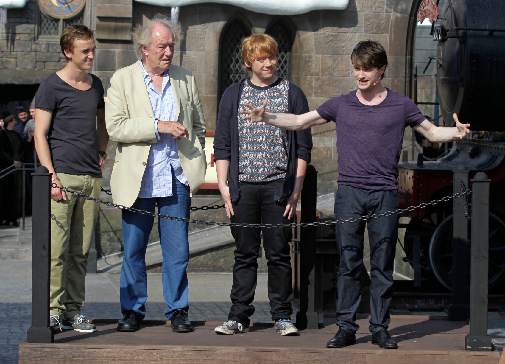 <p>FILE - Members of the cast of the Harry Potter films, from left, Tom Felton, Michael Gambon, Rupert Grint, and Daniel Radcliffe during grand opening ceremonies of the Wizarding World of Harry Potter at Universal Orlando theme park in Orlando, Florida, Friday, June 18, 2010. Actor Michael Gambon, who played Dumbledore in the later Harry Potter films, has died at age 82, his publicist says.</p>