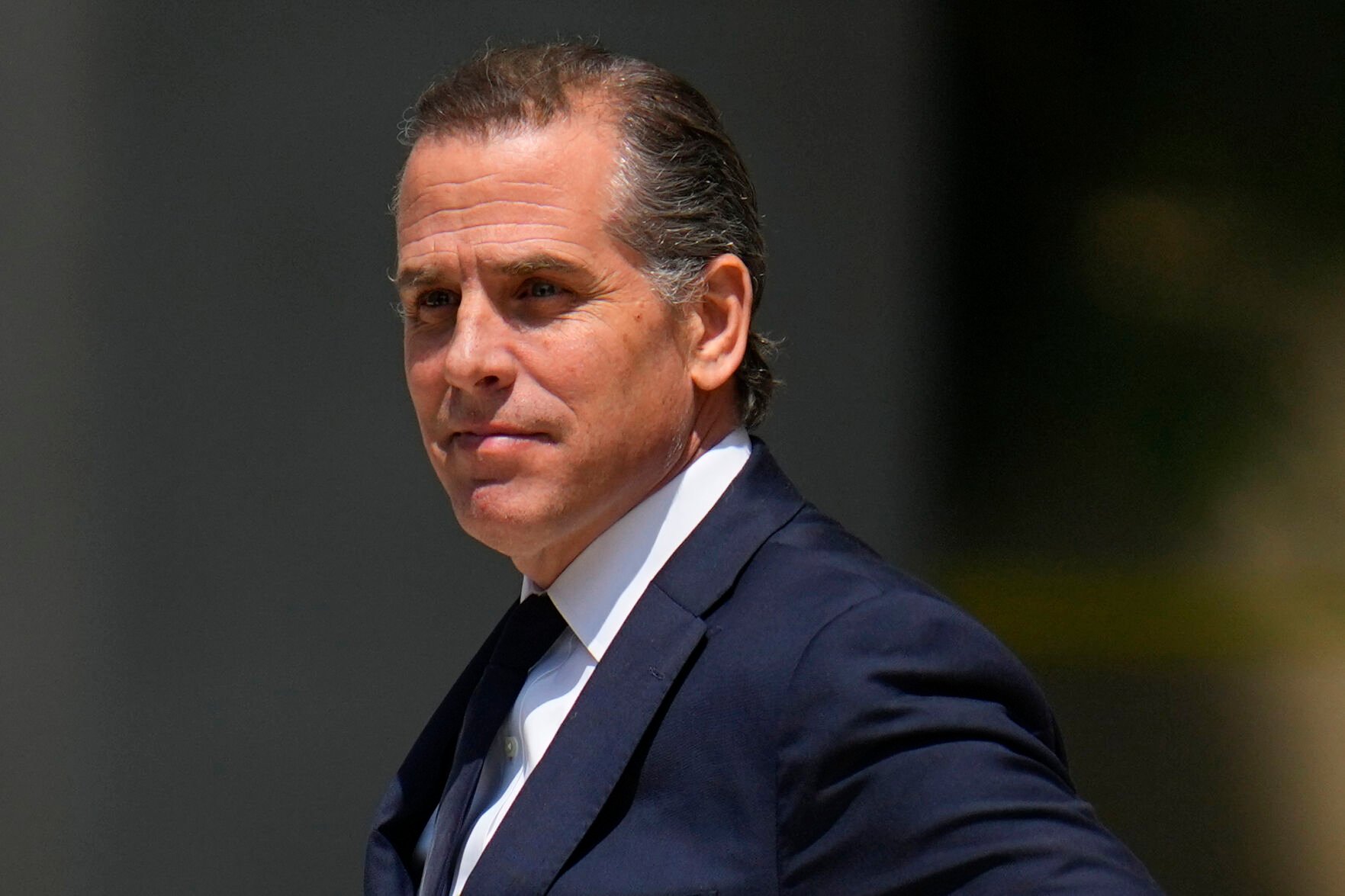 <p>FILE - President Joe Biden's son Hunter Biden leaves after a court appearance, Wednesday, July 26, 2023, in Wilmington, Del. Hunter Biden has been charged with felony gun possession. A federal indictment filed in Delaware says Biden lied about his drug use when he bought a firearm in 2018 while struggling with addiction to crack cocaine. </p>