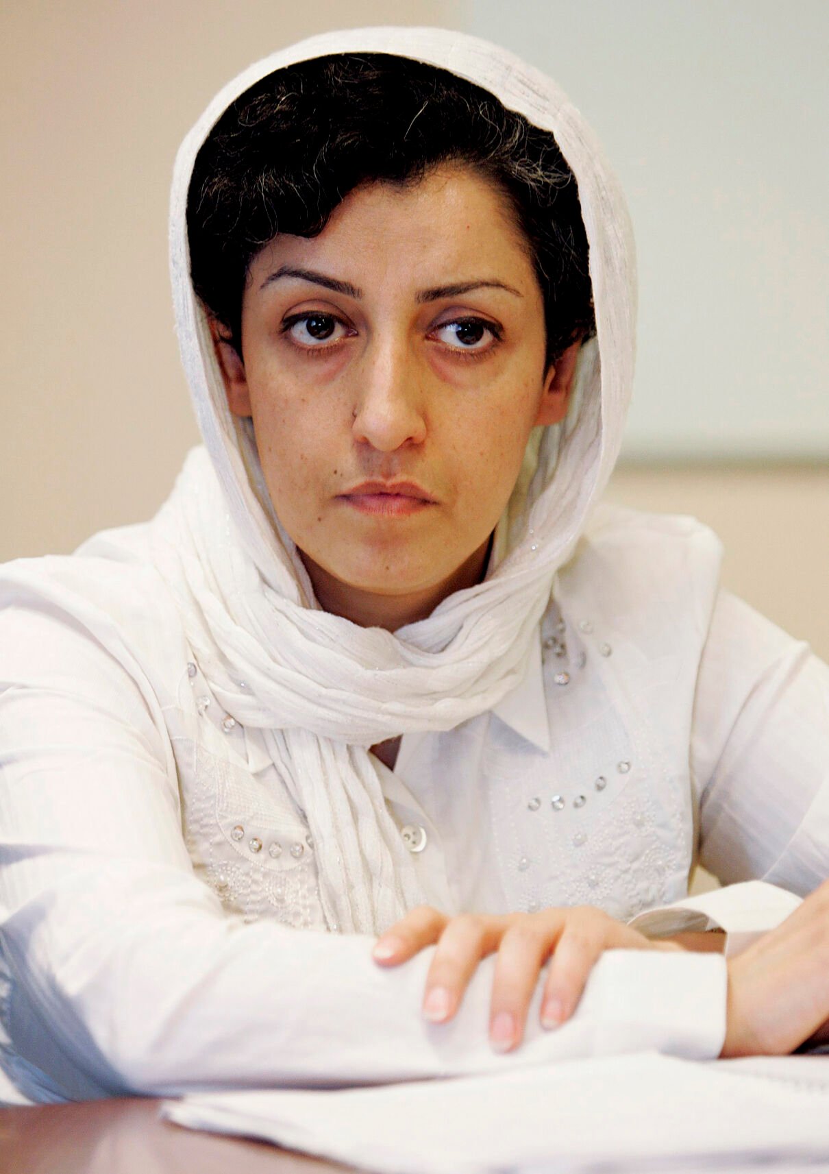 <p>FILE - Iranian Narges Mohammadi, delegate of the Center for Human Rights Defenders, listens to a question during a press conference on the Assessment of the Human Rights Situation in Iran, at the U.N. headquarters in Geneva, Switzerland, on June 9, 2008.</p>