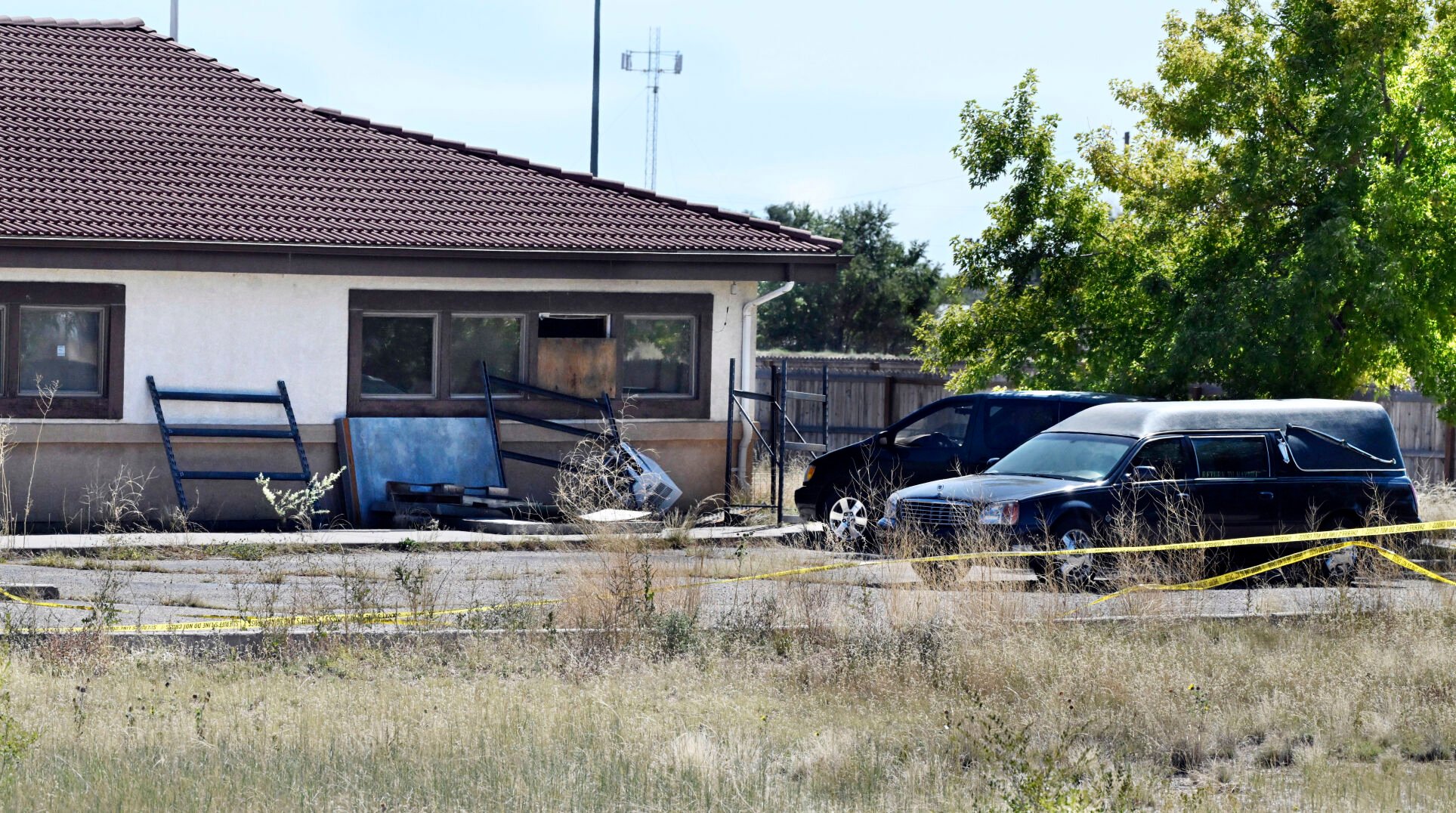 <p>A hearse and debris can be seen at the rear of the Return to Nature Funeral Home in Penrose, Colo. Thursday, Oct. 5, 2023. </p>