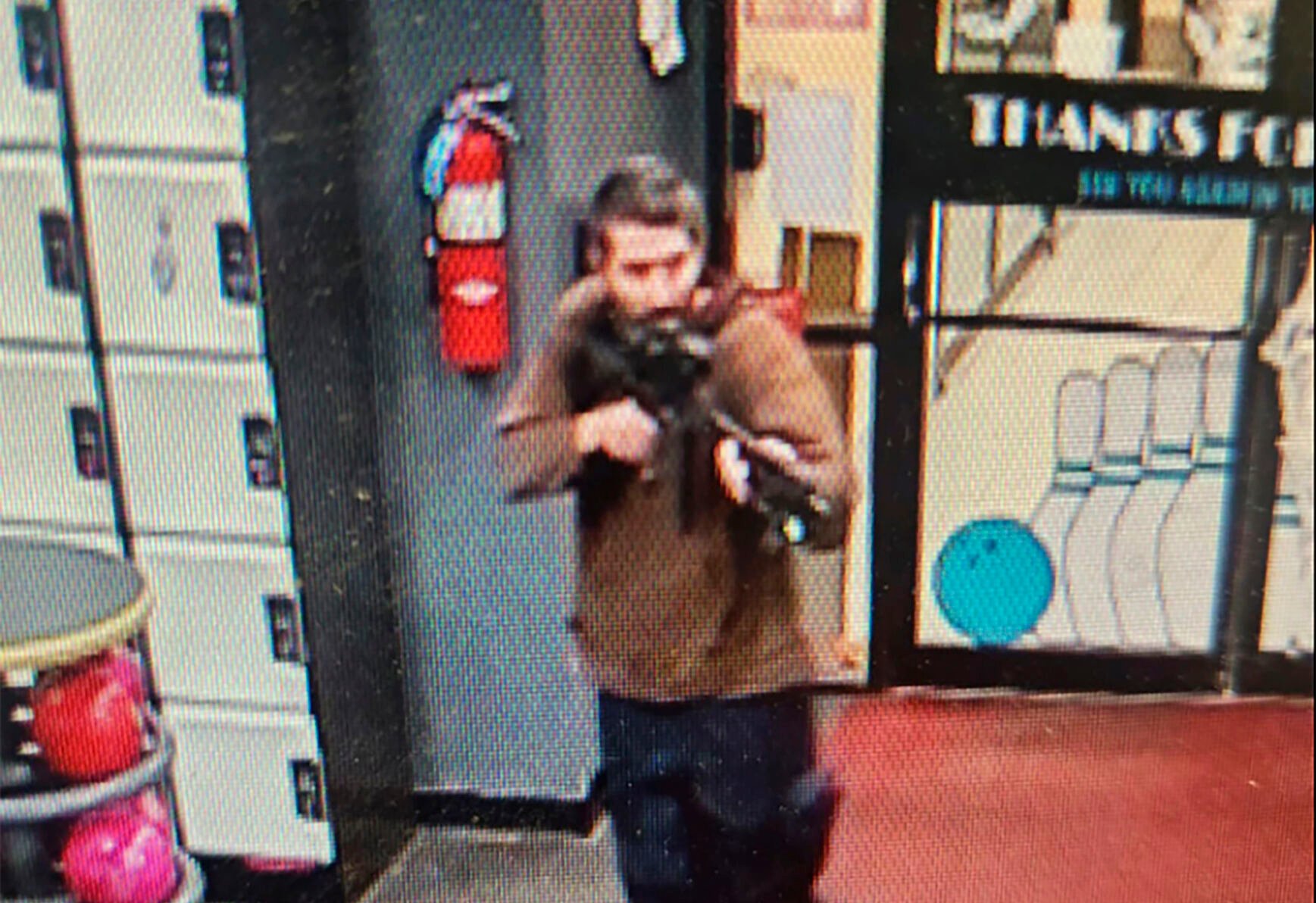 <p>In this image taken from video released by the Androscoggin County Sheriff's Office, an unidentified gunman points a gun while entering Sparetime Recreation in Lewiston, Maine, on Wednesday, Oct. 25, 2023. Maine State Police ordered residents in the state's second-largest city to shelter in place Wednesday night as the suspect remains at large. (Androscoggin County Sheriff's Office via AP)</p>