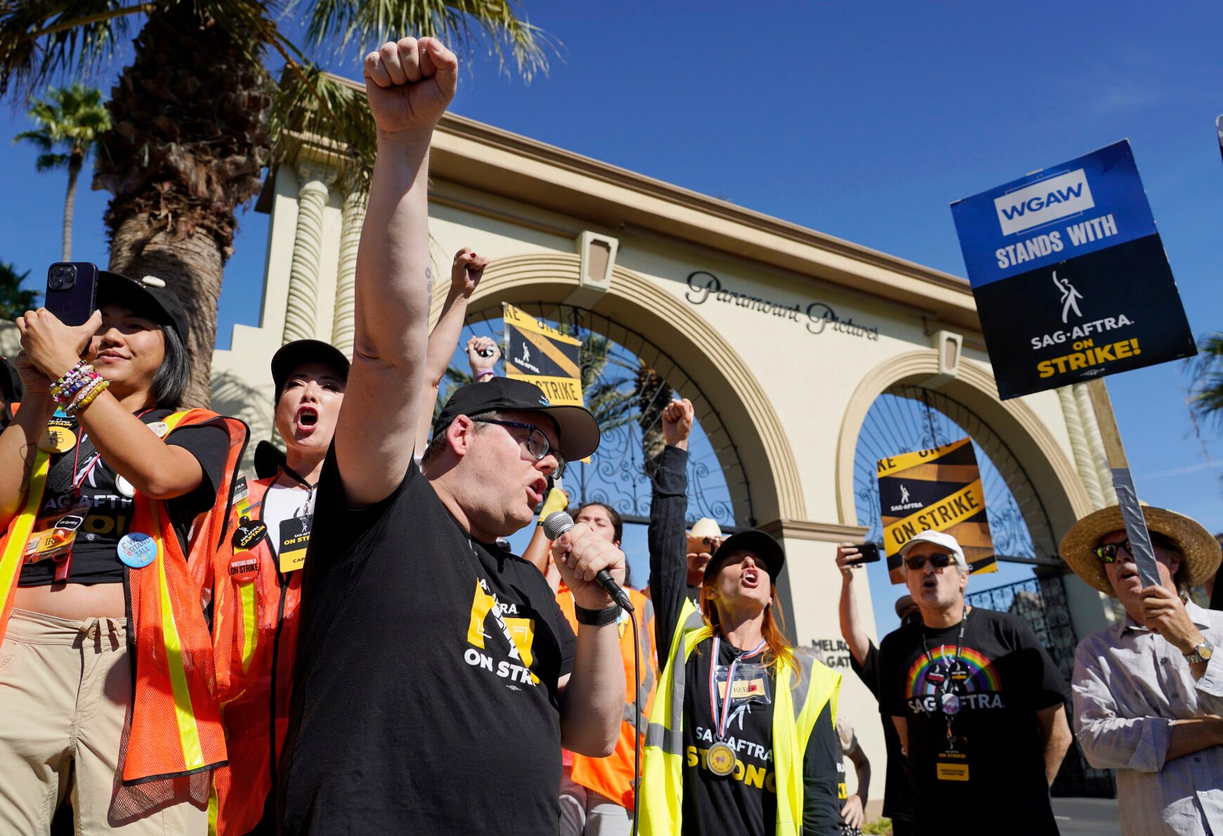 <p>SAG-AFTRA chief negotiator Duncan Crabtree-Ireland, left, rallies striking actors Nov. 3 outside Paramount Pictures studio in Los Angeles. The union announced late Wednesday it had reached a deal with studios that will end the strike.</p>