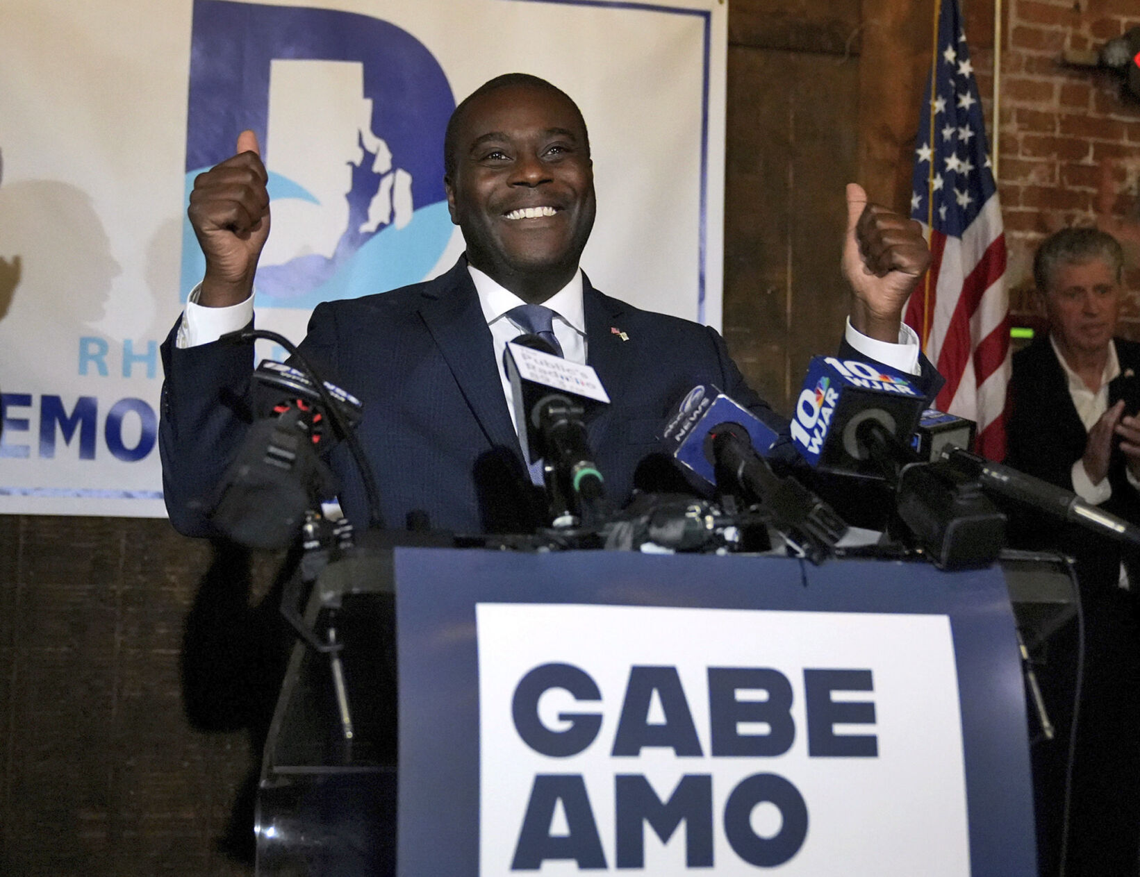 <p>Democrat Gabe Amo gives both thumbs up to the room full of election night supporters Tuesday at The Guild in Pawtucket, R.I., after winning Rhode Island’s 1st Congressional District seat. The former White House aide will become the state’s first Black candidate elected to the U.S. House.  </p>