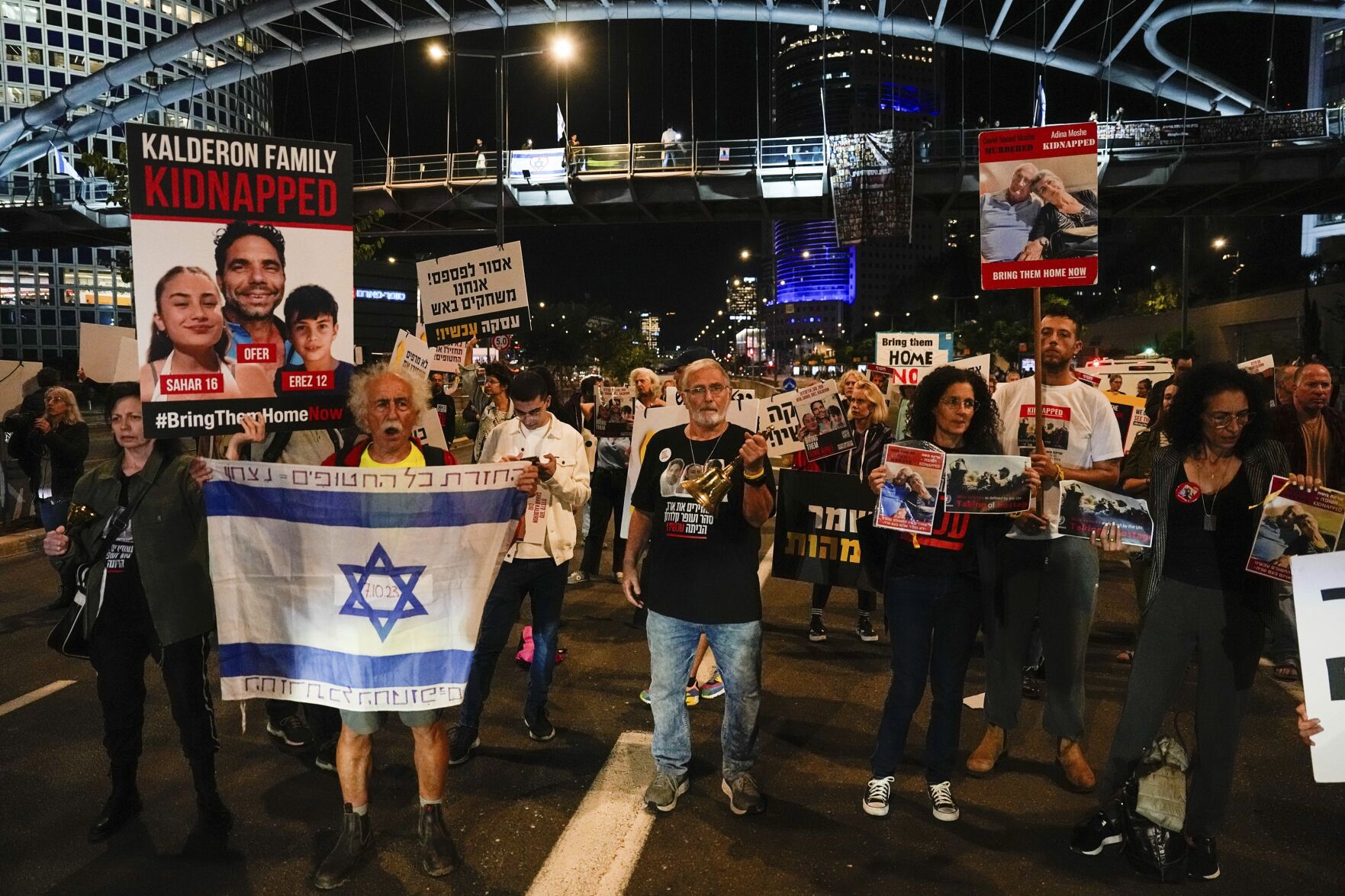 <p>Families and friends of about 240 hostages held by Hamas in Gaza call Tuesday for Israeli Prime Minister Benjamin Netanyahu to bring them home during a demonstration in Tel Aviv, Israel.</p>