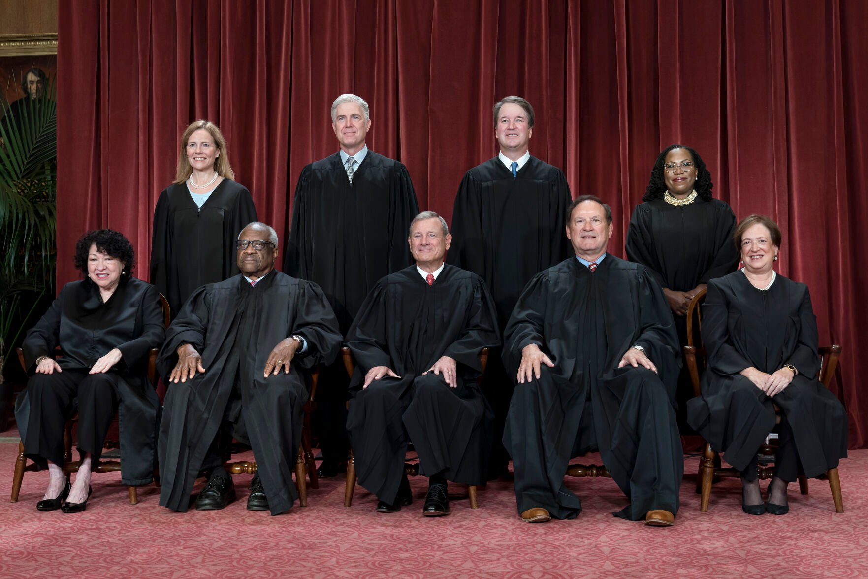 <p>FILE - Members of the Supreme Court sit for a new group portrait following the addition of Associate Justice Ketanji Brown Jackson, at the Supreme Court building in Washington, Oct. 7, 2022. Bottom row, from left, Justice Sonia Sotomayor, Justice Clarence Thomas, Chief Justice John Roberts, Justice Samuel Alito, and Justice Elena Kagan. Top row, from left, Justice Amy Coney Barrett, Justice Neil Gorsuch, Justice Brett Kavanaugh, and Justice Ketanji Brown Jackson. The Supreme Court is adopting its first code of ethics, in the face of sustained criticism over undisclosed trips and gifts from wealthy benefactors to some justices. The policy was issued by the court Monday. </p>