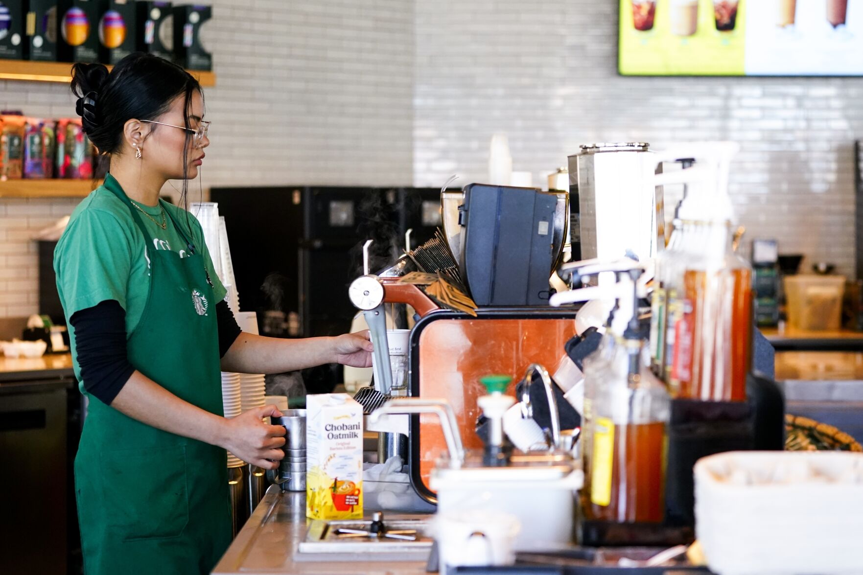 <p>File - Nicole Lipa prepares a drink at a Starbucks location, June 28, 2023, in Seattle. On Friday, the U.S. government issues its November jobs report. (AP Photo/Lindsey Wasson, File)</p>