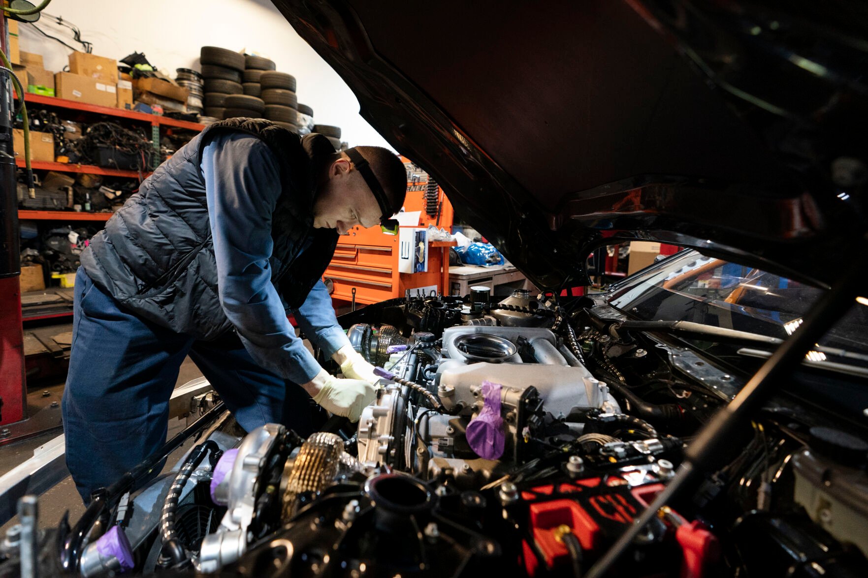 <p>File - Mechanic David Stoliaruk works on the engine of a car at IC Auto in Philadelphia, May 2, 2023. On Friday, the U.S. government issues its November jobs report. (AP Photo/Matt Rourke, File)</p>