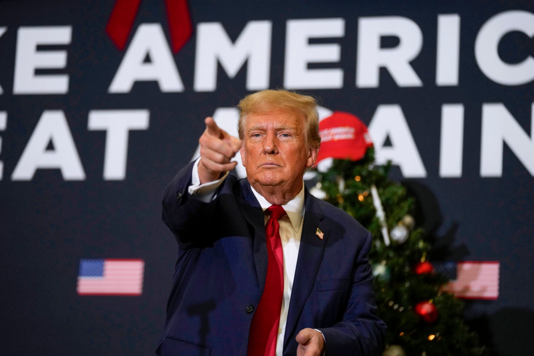 <p>Former President Donald Trump points to supporters during rally Dec. 19 in Waterloo, Iowa. <span>The Supreme Court will decide whether former President Donald Trump can be kept off the 2024 presidential ballot because of his efforts to overturn his 2020 election loss that culminated in the U.S. Capitol attack.</span></p>
