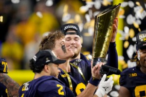 Michigan Completes Undefeated Season With 34 13 College Football Playoff Championship Game Victory Over Washington