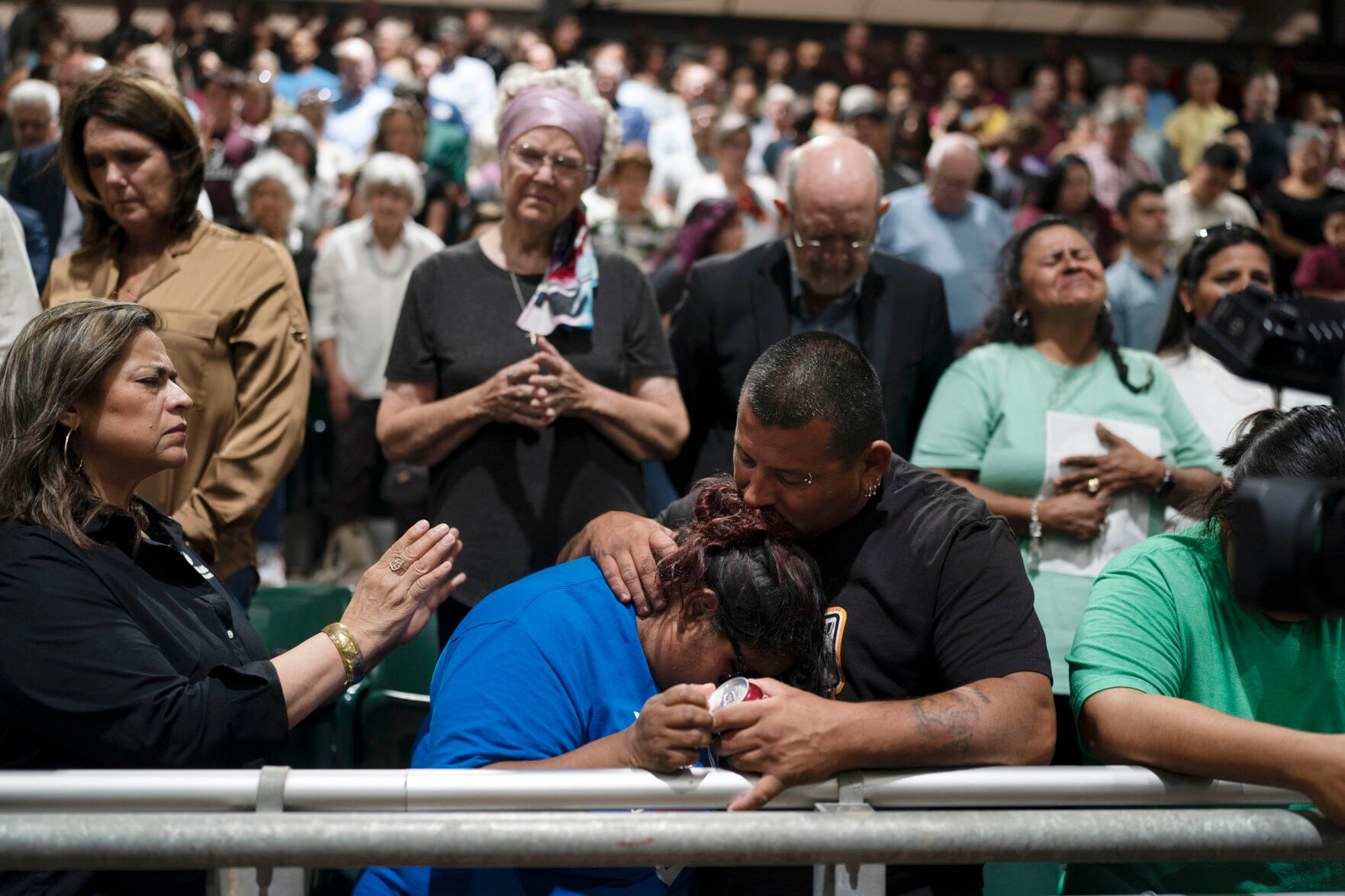 <p>Two family members of one of the victims killed in Tuesday's shooting at Robb Elementary School comfort each other May 25, 2022, during a prayer vigil in Uvalde, Texas.</p>