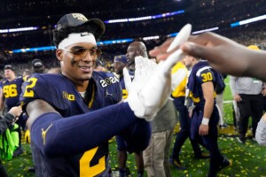 Michigan Completes Undefeated Season With 34 13 College Football Playoff Championship Game Victory Over Washington