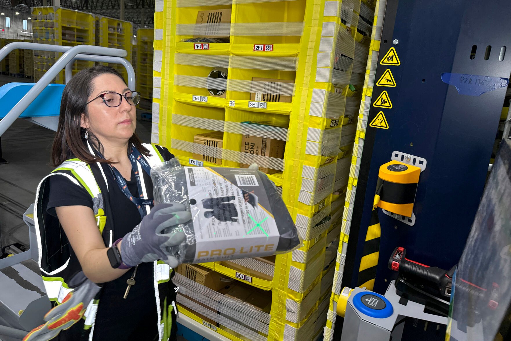 <p>A worker moves a package at an Amazon same-day delivery shipping center in Woodland Park, New Jersey, on Monday, December 18, 2023. On Friday, the U.S. government issues its December jobs report.(AP Photo/Ted Shaffrey)</p>