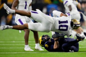 Michigan Completes Undefeated Season With 34 13 College Football Playoff Championship Game Victory Over Washington