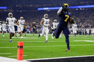 Michigan Completes Undefeated Season With 34 13 College Football Playoff Championship Game Victory Over Washington