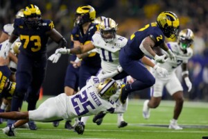 Michigan Completes Undefeated Season With 34 13 College Football Playoff Championship Game Victory Over Washington