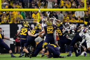 Michigan Completes Undefeated Season With 34 13 College Football Playoff Championship Game Victory Over Washington