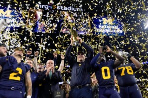 Michigan Completes Undefeated Season With 34 13 College Football Playoff Championship Game Victory Over Washington