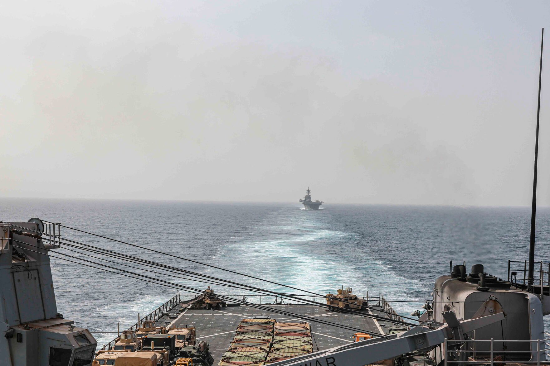 <p>The amphibious dock landing ship USS Carter Hall and amphibious assault ship USS Bataan transit the Bab al-Mandeb strait on Aug. 9, 2023. The top commander of U.S. naval forces in the Middle East says Yemen’s Houthi rebels are showing no signs of ending their “reckless” attacks on commercial ships in the Red Sea.  </p>