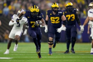 Michigan Completes Undefeated Season With 34 13 College Football Playoff Championship Game Victory Over Washington