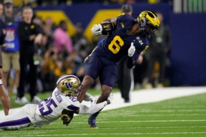 Michigan Completes Undefeated Season With 34 13 College Football Playoff Championship Game Victory Over Washington