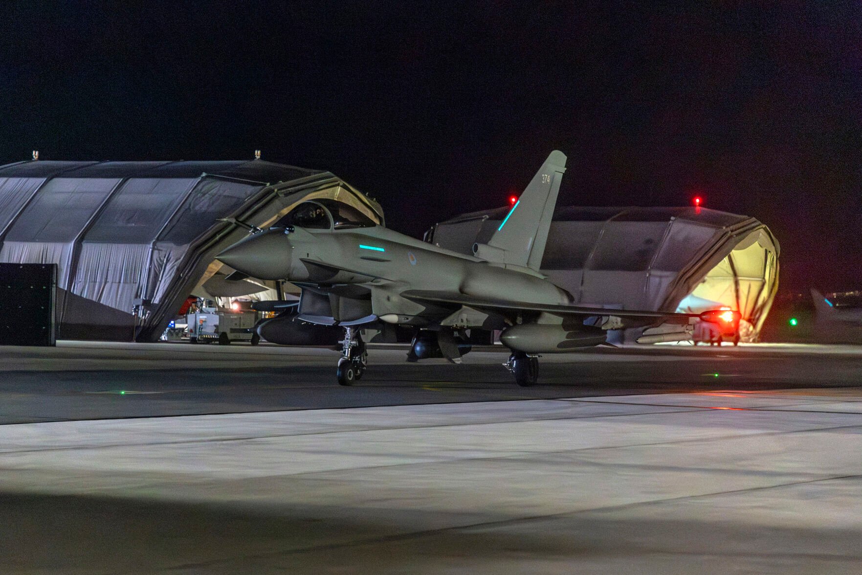 <p>An RAF Typhoon aircraft returns to base Thursday night at RAF Akrotiri in Cyprus after striking targets in Yemen. T </p>