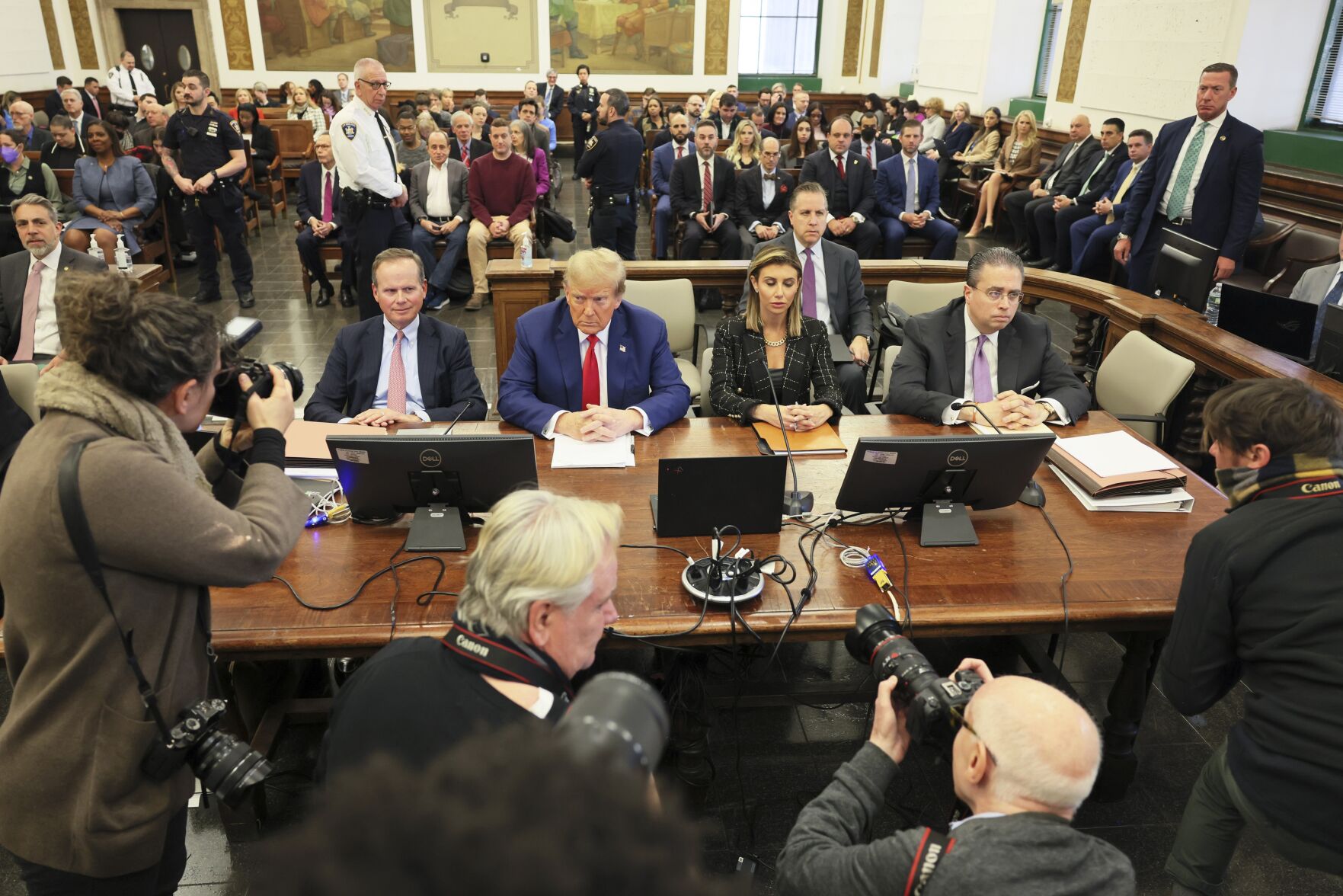 <p>Former President Donald Trump, center, sits in the courtroom Jan. 11 before the start of closing arguments in his civil business fraud trial at New York Supreme Court in New York. <span>A New York judge ruled against Trump Friday, imposing a 4 million penalty over what the judge said was a yearslong scheme to dupe banks and others with financial statements that inflated the former president’s wealth. </span></p>