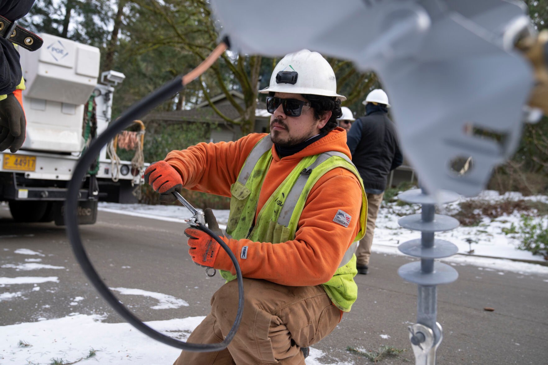 <p>File - A worker from Portland General Electric replaces a power line as crews work to restore power after a storm on Jan. 16, 2024, in Lake Oswego, Ore. On Friday, Feb. 2, 2024, the U.S. government issues its January jobs report.</p>