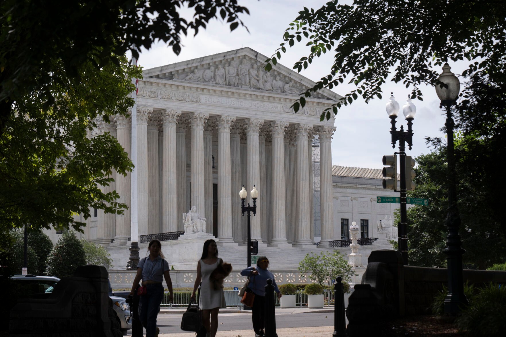 <p>People walk past the Supreme Court on Thursday, June 27, 2024, in Washington.</p>