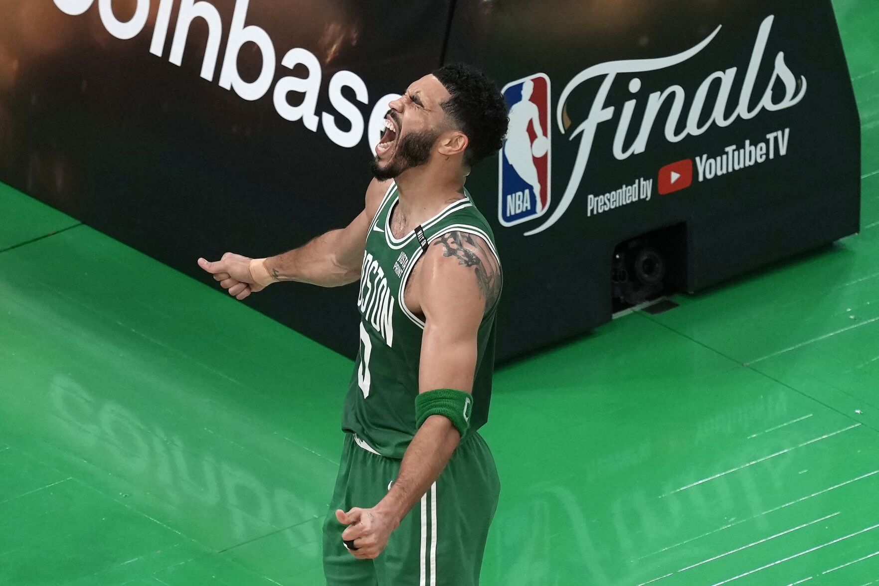 <p>The Boston Celtics' Jayson Tatum celebrates after scoring during Game 5 of the NBA Finals against the Dallas Mavericks on Monday in Boston.</p>