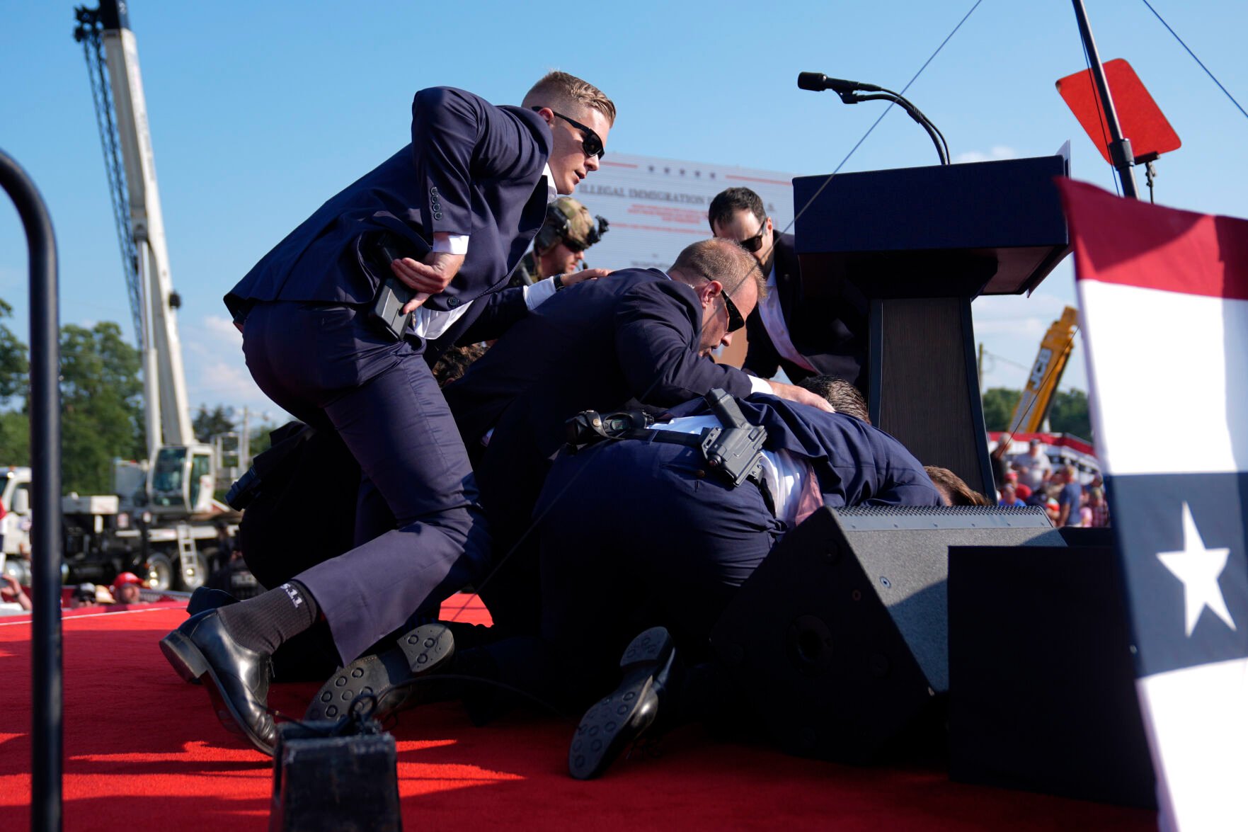 <p>Republican presidential candidate former President Donald Trump is covered by U.S. Secret Service agents at a campaign rally Saturday in Butler, Pa.</p>