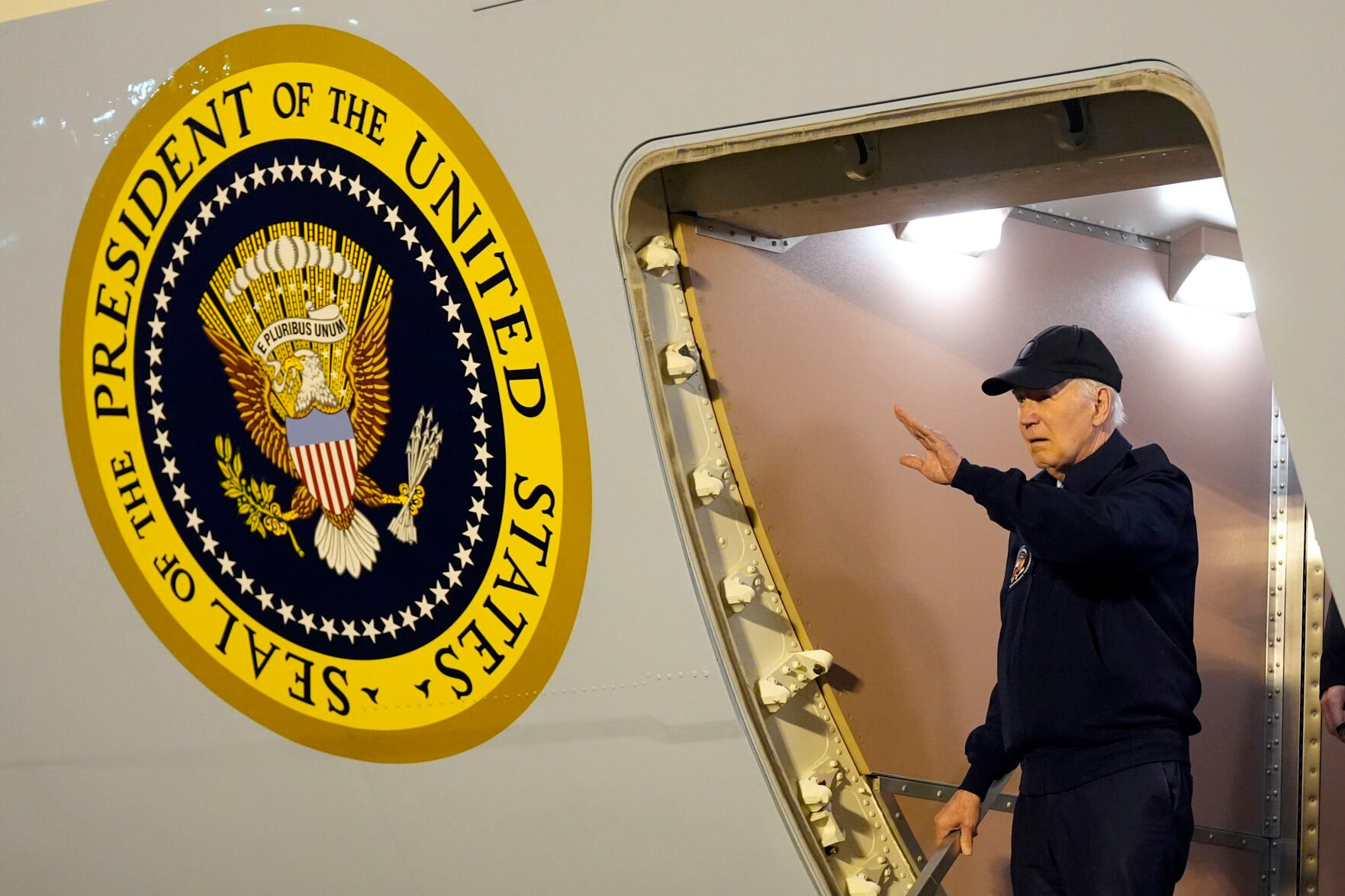 <p>President Joe Biden walks down the steps of Air Force One on Wednesday at Dover Air Force Base in Delaware.</p>