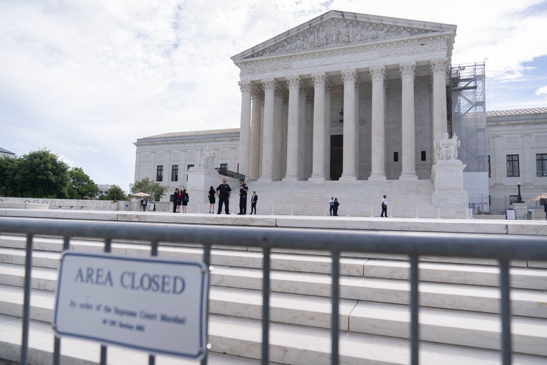 <p>Law enforcement officers stand behind barricades outside the Supreme Court on Thursday, June 27, 2024, in Washington. </p>
