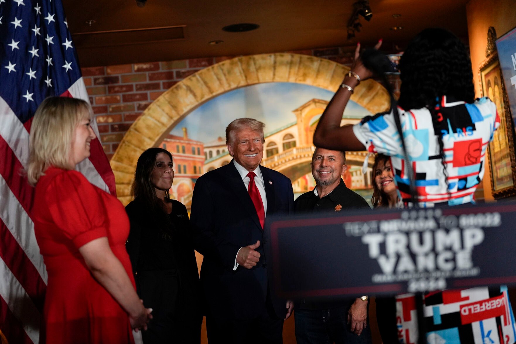 <p>Republican presidential nominee former President Donald Trump poses for a photo Friday at a campaign event at ll Toro E La Capra in Las Vegas. Second from right is restaurant owner Javier Barajas.</p>