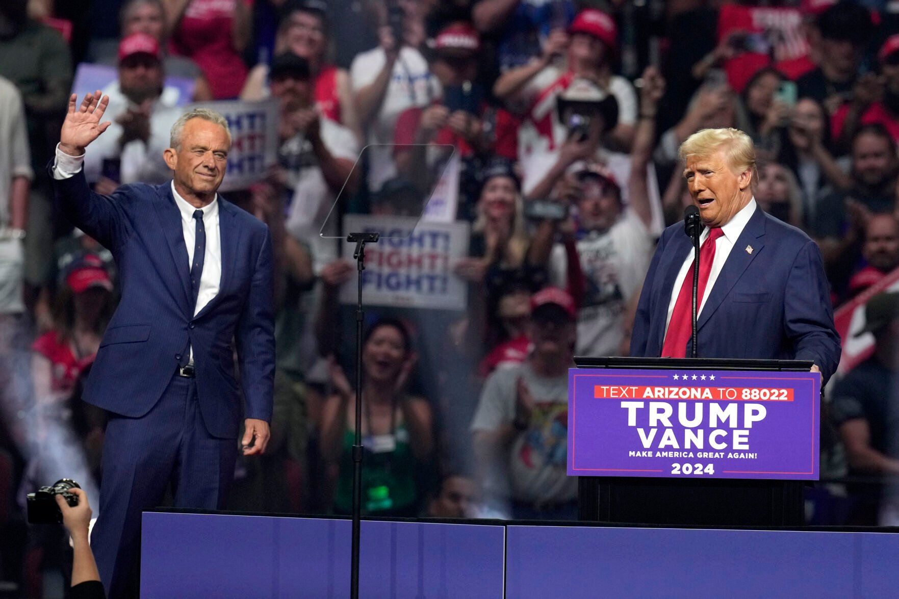 <p>Independent presidential candidate Robert F. Kennedy Jr., left, waves to the crowd Friday as Republican presidential nominee and former President Donald Trump speaks at a campaign rally in Glendale, Ariz.</p>