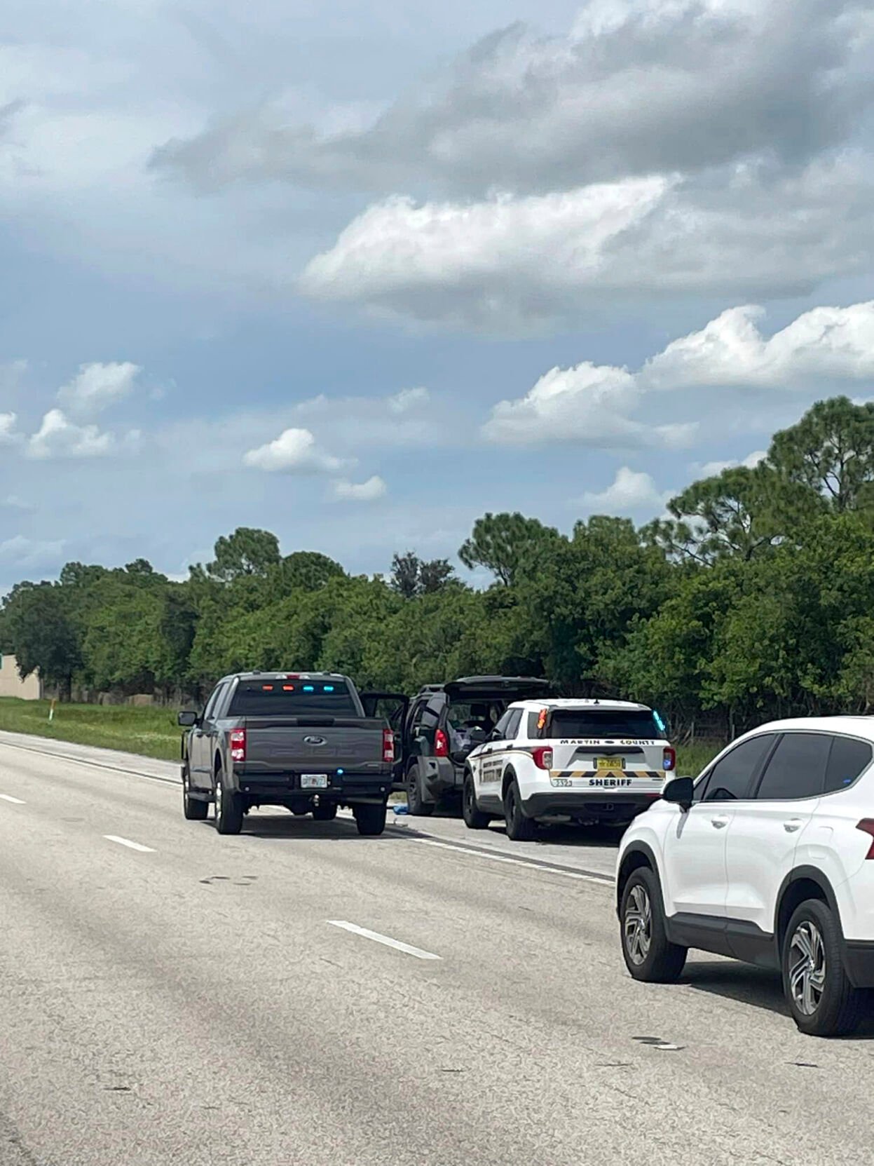 <p>This photo provided by the Martin County Sheriff's Office shows Sheriff's vehicles surrounding an SUV on the northbound I-95 in Martin County on Sunday.</p>