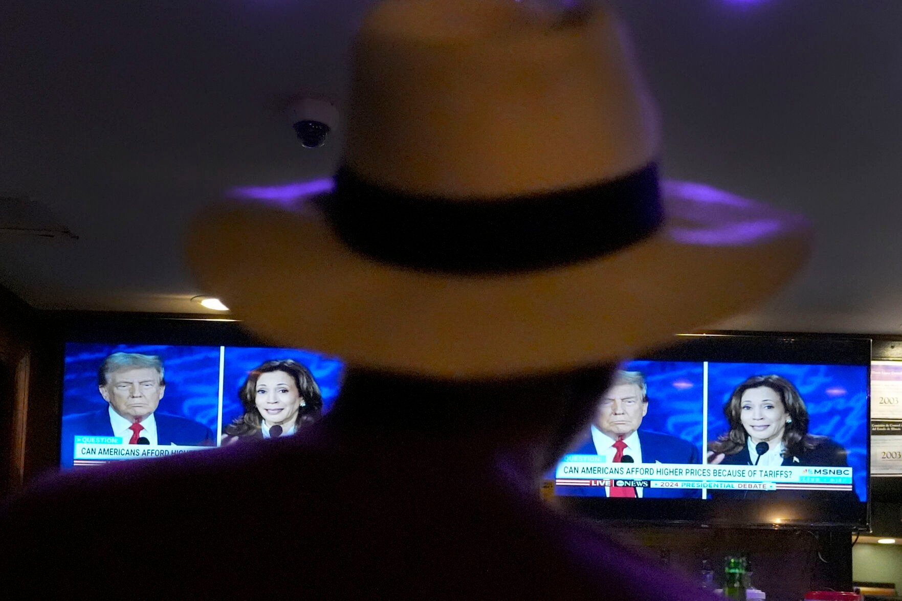 <p>Charles Hudson, 76, of Chicago watches the presidential debate Tuesday between Republican presidential nominee former President Donald Trump and Democratic presidential nominee Vice President Kamala Harris, at the Knotty Luxe Bistro in Markham, Ill.</p>