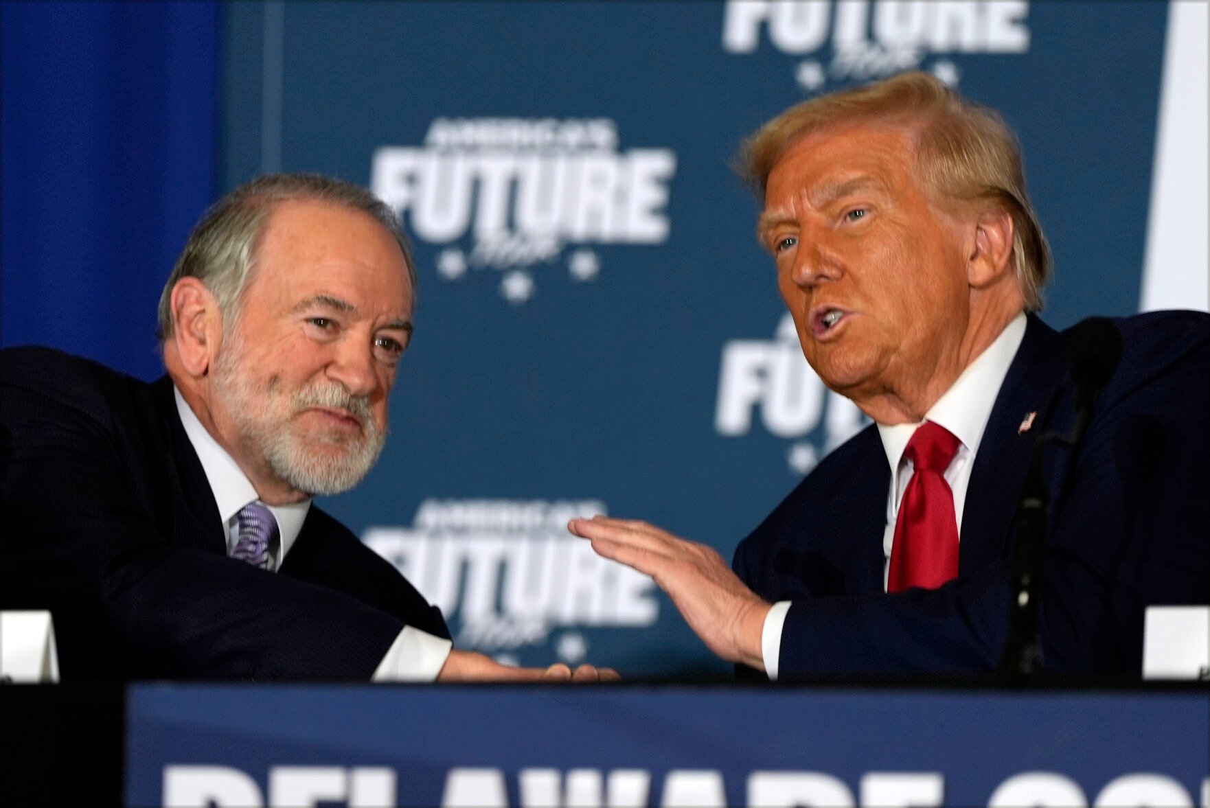 <p>Republican presidential nominee former President Donald Trump talks with former Arkansas Gov. Mike Huckabee during a roundtable Oct. 29 at the Drexelbrook Catering & Event Center in Drexel Hill, Pa.</p>