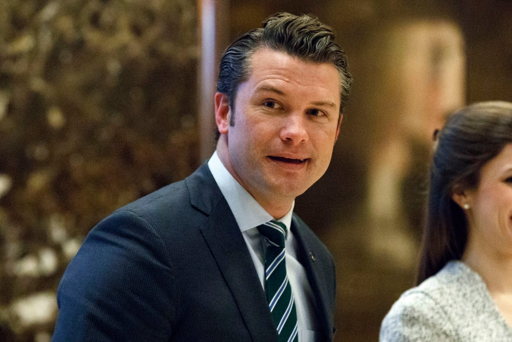 <p>Pete Hegseth walks to an elevator Dec. 15, 2016, for a meeting with President-elect Donald Trump at Trump Tower in New York.</p>