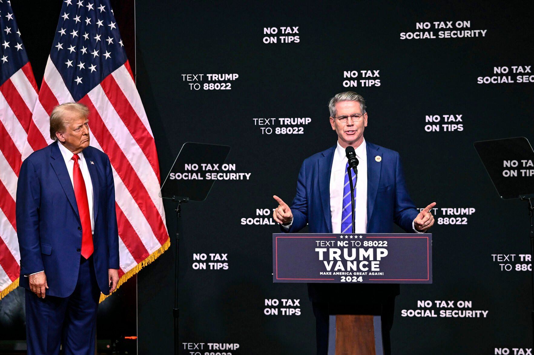 <p>Donald Trump, left, listens Aug. 14 as investor Scott Bessent speaks in Asheville, N.C.</p>