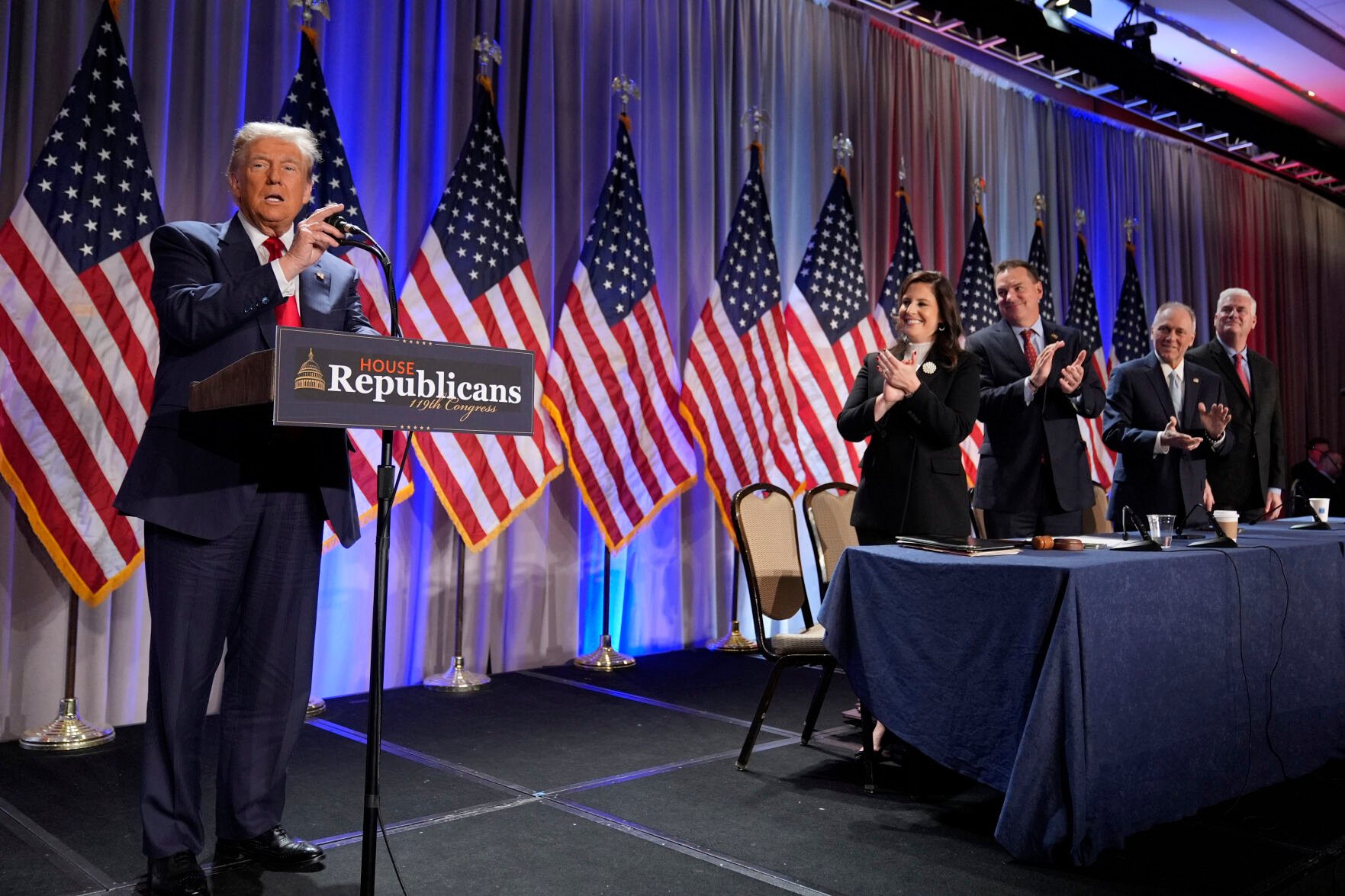 <p>President-elect Donald Trump speaks Wednesday as he arrives for a meeting with the House GOP conference in Washington. From left are Rep. Elise Stefanik, R-N.Y.; Rep. Richard Hudson, R-N.C.; Rep. Steve Scalise, R-La., and Rep. Tom Emmer, R-Minn.</p>