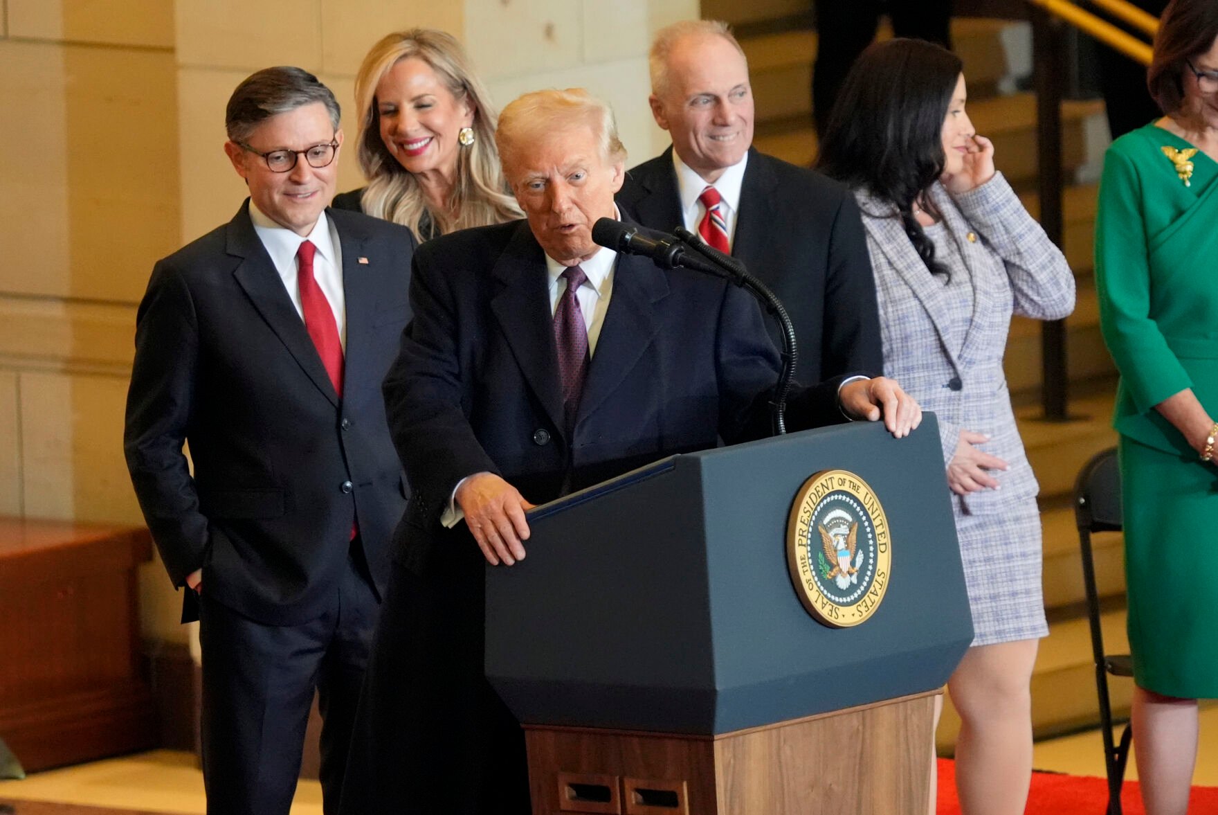 <p>President Donald Trump speaks from Emancipation Hall as House Speaker Mike Johnson, from left, his wife Kelly Johnson, House Majority Leader Steve Scalise, R-La., and his wife Jennifer Scalise, listen after the 60th Presidential Inauguration, Monday, Jan. 20, 2025, at the U.S. Capitol in Washington. (Jasper Colt/Pool Photo via AP)</p>