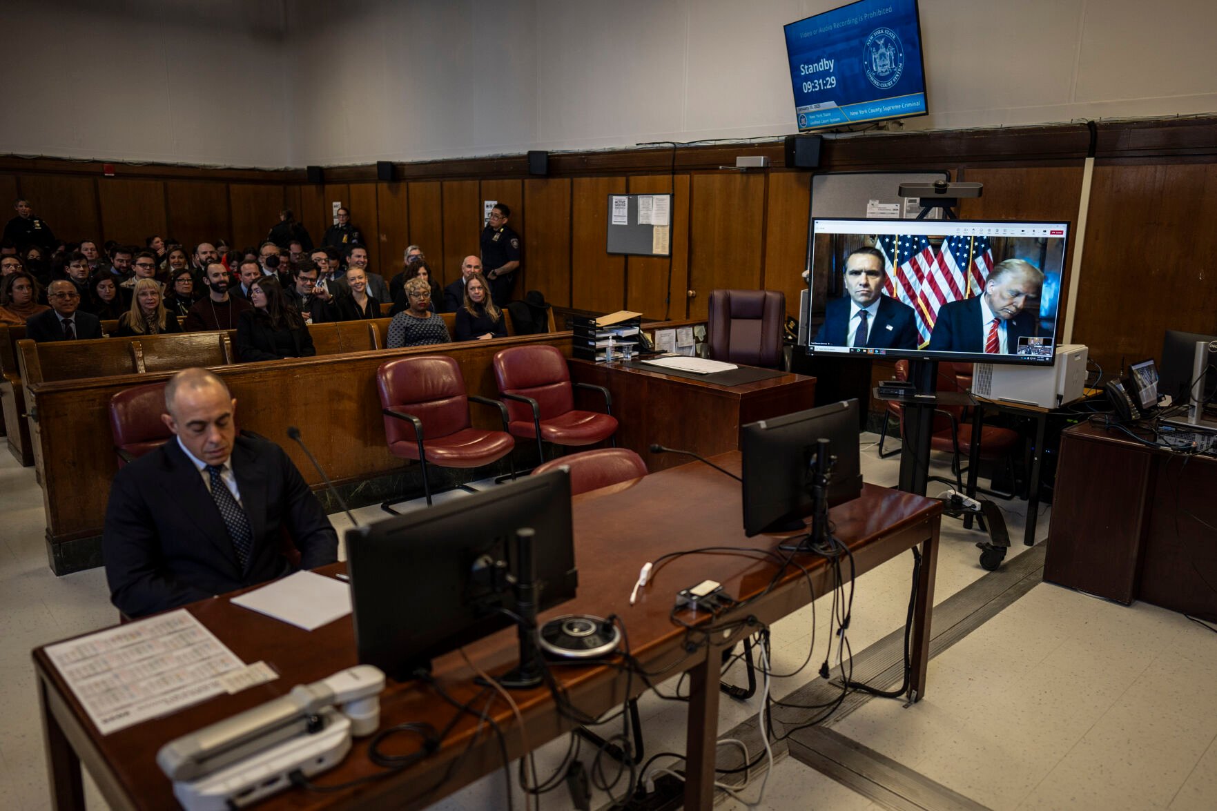 <p>Attorney Emil Bove, left, listens as attorney Todd Blanche and President-elect Donald Trump, seen on a television screen, appear virtually for sentencing for Trump's hush money conviction in a Manhattan courtroom on Friday, Jan. 10, 2025 in New York. (Jabin Botsford/The Washington Post via AP, Pool)</p>
