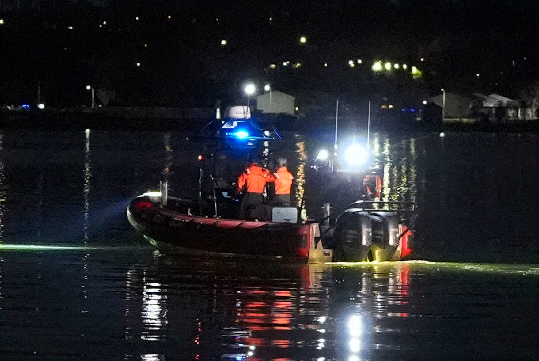 <p>A boat works the scene near Ronald Reagan Washington National Airport, Thursday, Jan. 30, 2025, in Arlington, Va. (AP Photo/Alex Brandon)</p>