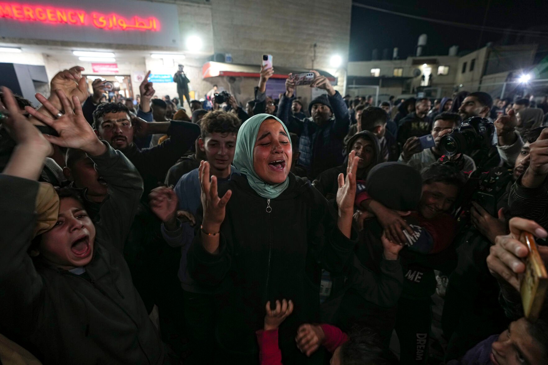 <p>Palestinians celebrate the announcement of a ceasefire deal between Hamas and Israel in Deir al-Balah, central Gaza Strip, Wednesday, Jan. 15, 2025. (AP Photo/Abdel Kareem Hana)</p>